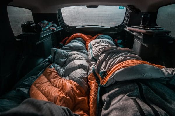 black and orange backpack on car seat